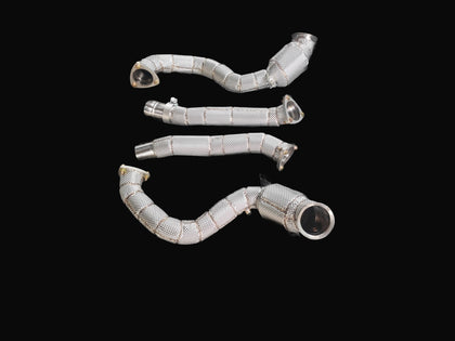Aston Martin DB12 M177 stainless steel downpipes with heat shield wrap — flat layout view
