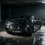 McLaren 570S with YPG Longtail carbon fiber body kit — moody garage editorial photo