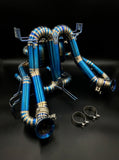 Lamborghini Revuelto titanium valvetronic exhaust three-quarter view with V-band clamps
